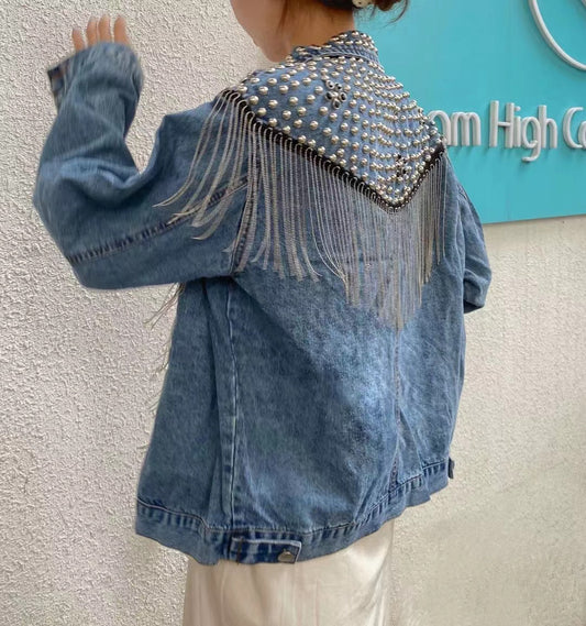 Loose fitting denim jacket with wicker fringe trim